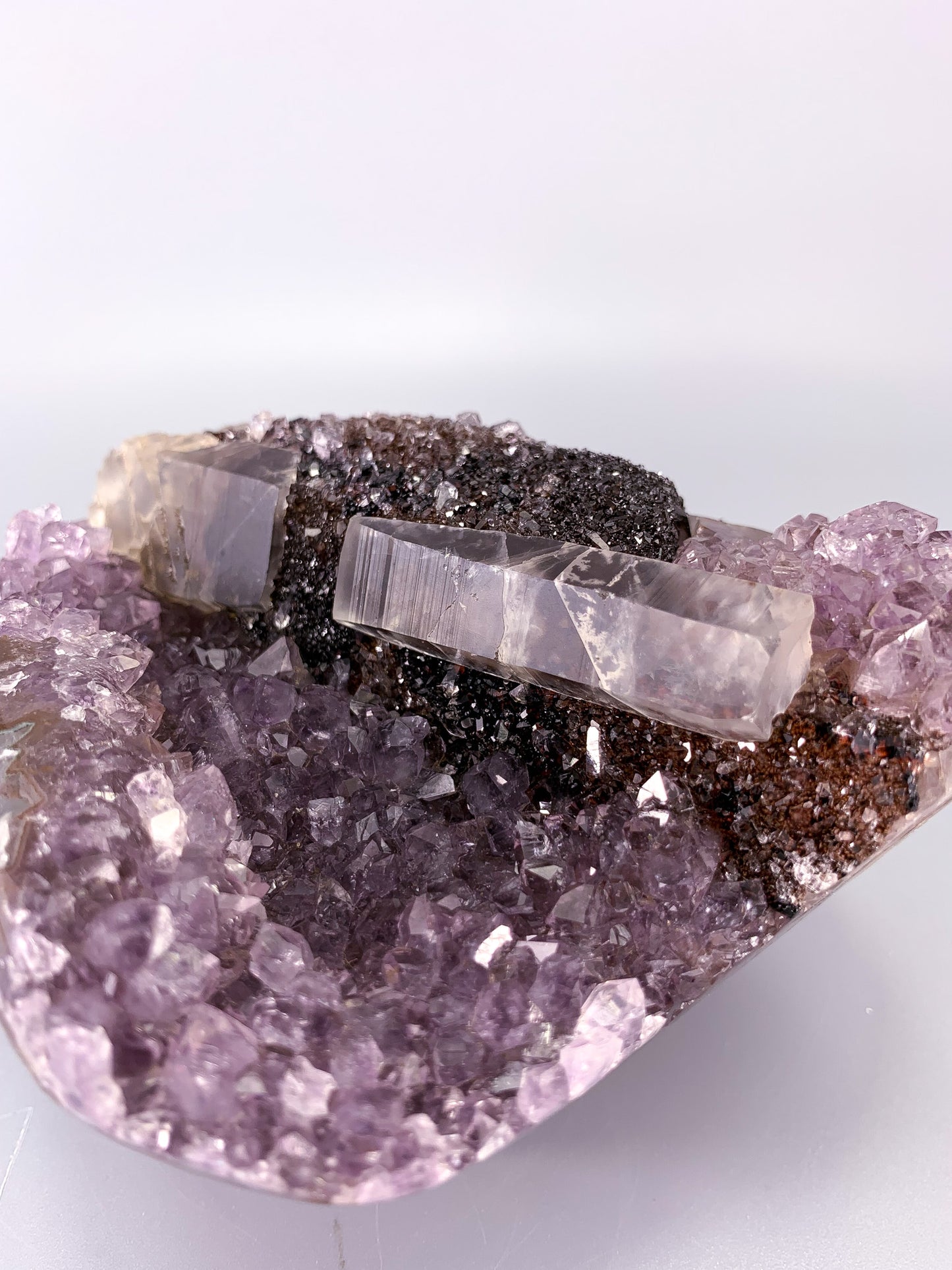 Amethyst natural cluster cut base with calcite and Red/Black Hematite