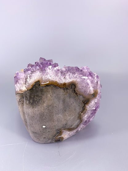 Amethyst natural cut base cluster with fish shaped calcite