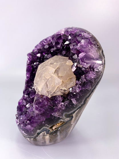 Amethyst natural cut base cluster with calcite