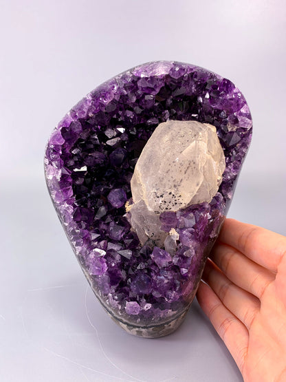 Amethyst natural cut base cluster with calcite