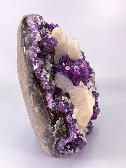 Amethyst natural cluster cut base with calcite and Hematite