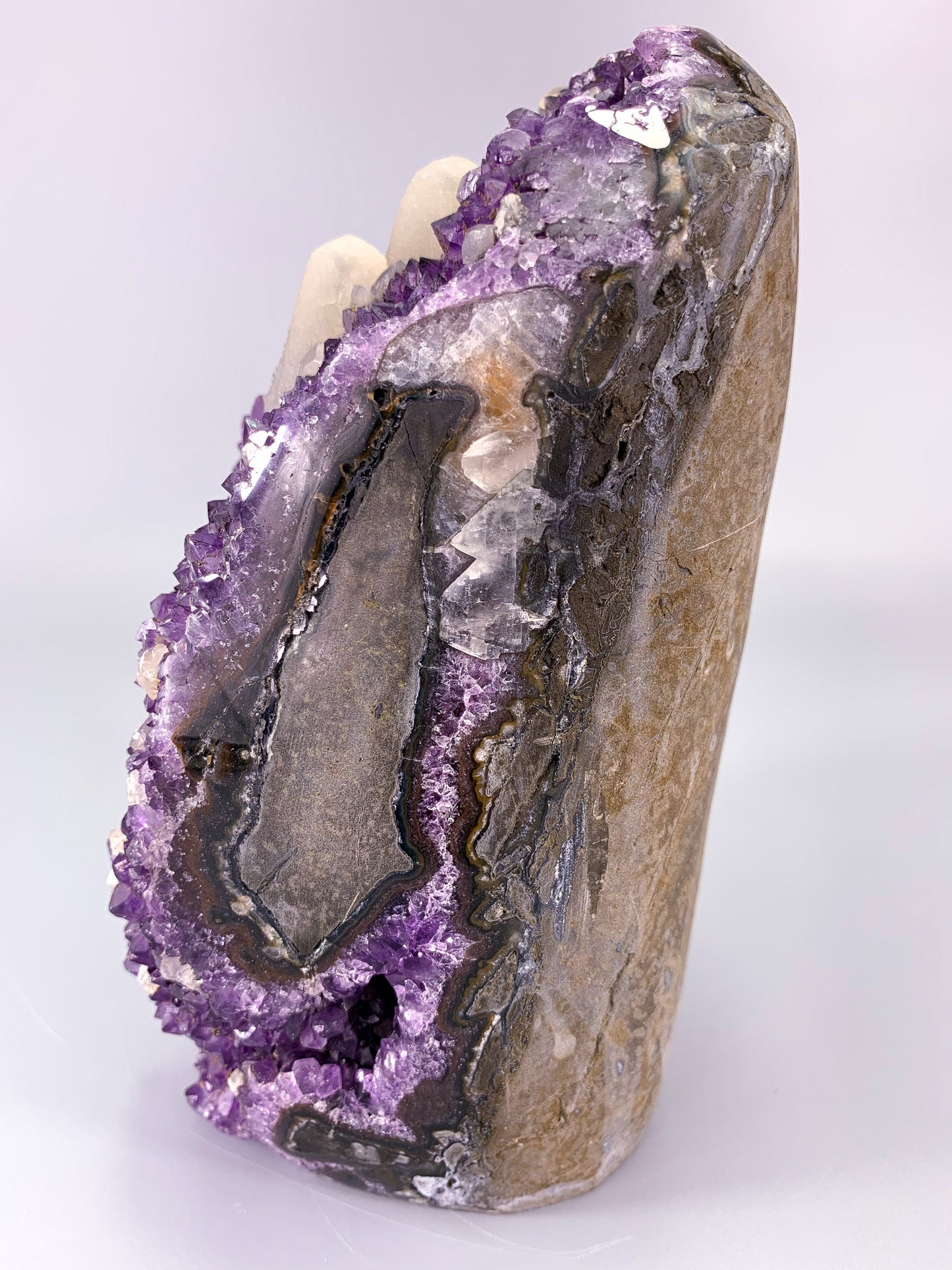 Amethyst natural cluster cut base with calcite and Hematite