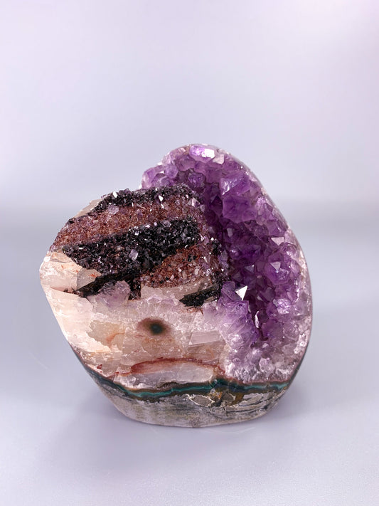 Amethyst natural cluster cut base with calcite and Hematite