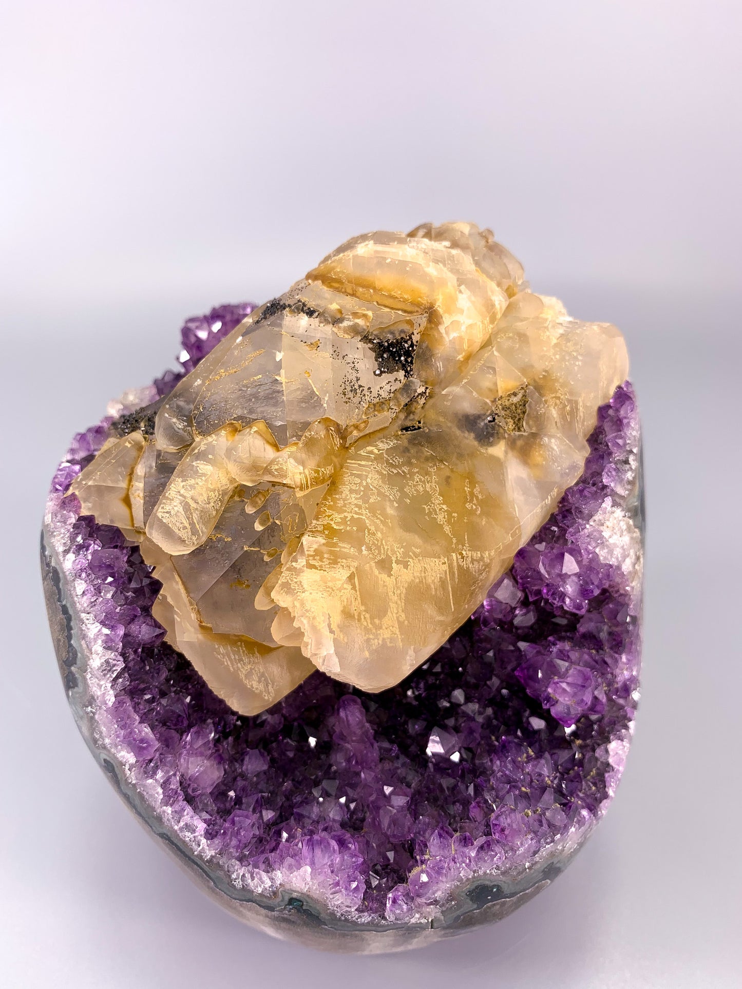 Amethyst natural cluster cut base with calcite and Hematite