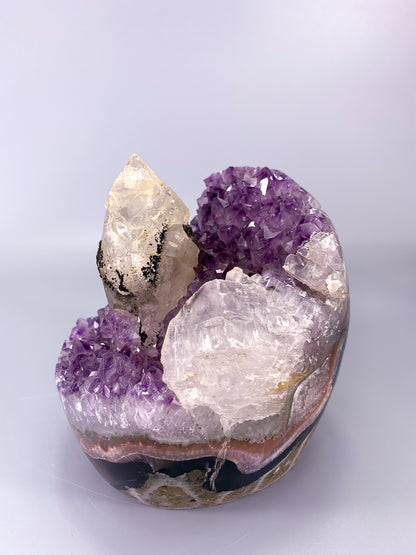 Amethyst natural cluster cut base with clear calcite point and Hematite