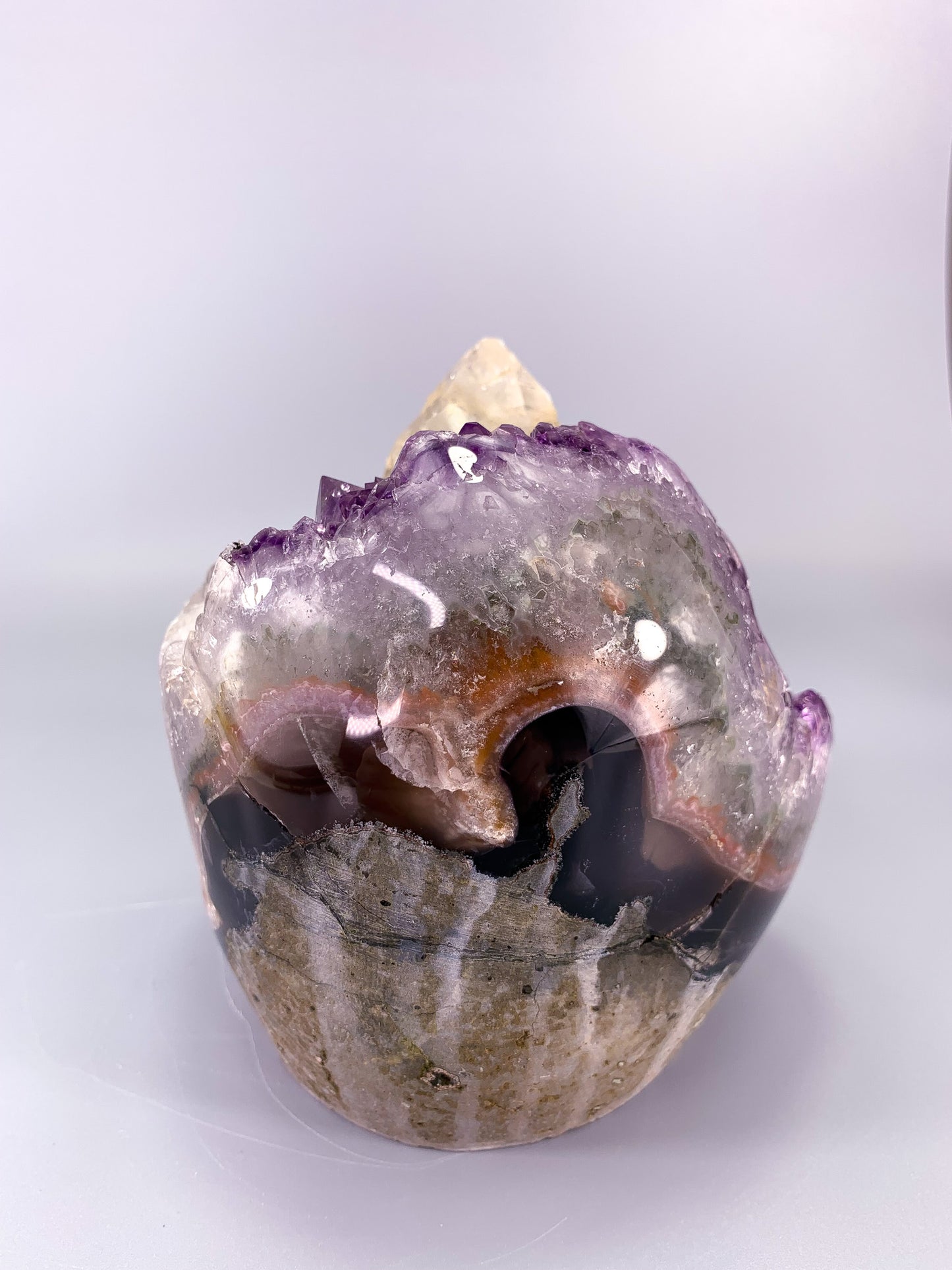 Amethyst natural cluster cut base with clear calcite point and Hematite