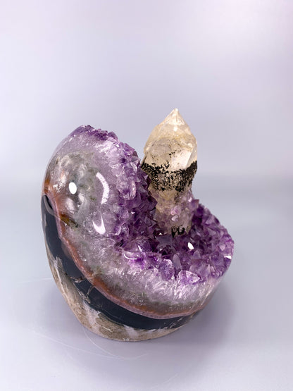 Amethyst natural cluster cut base with clear calcite point and Hematite