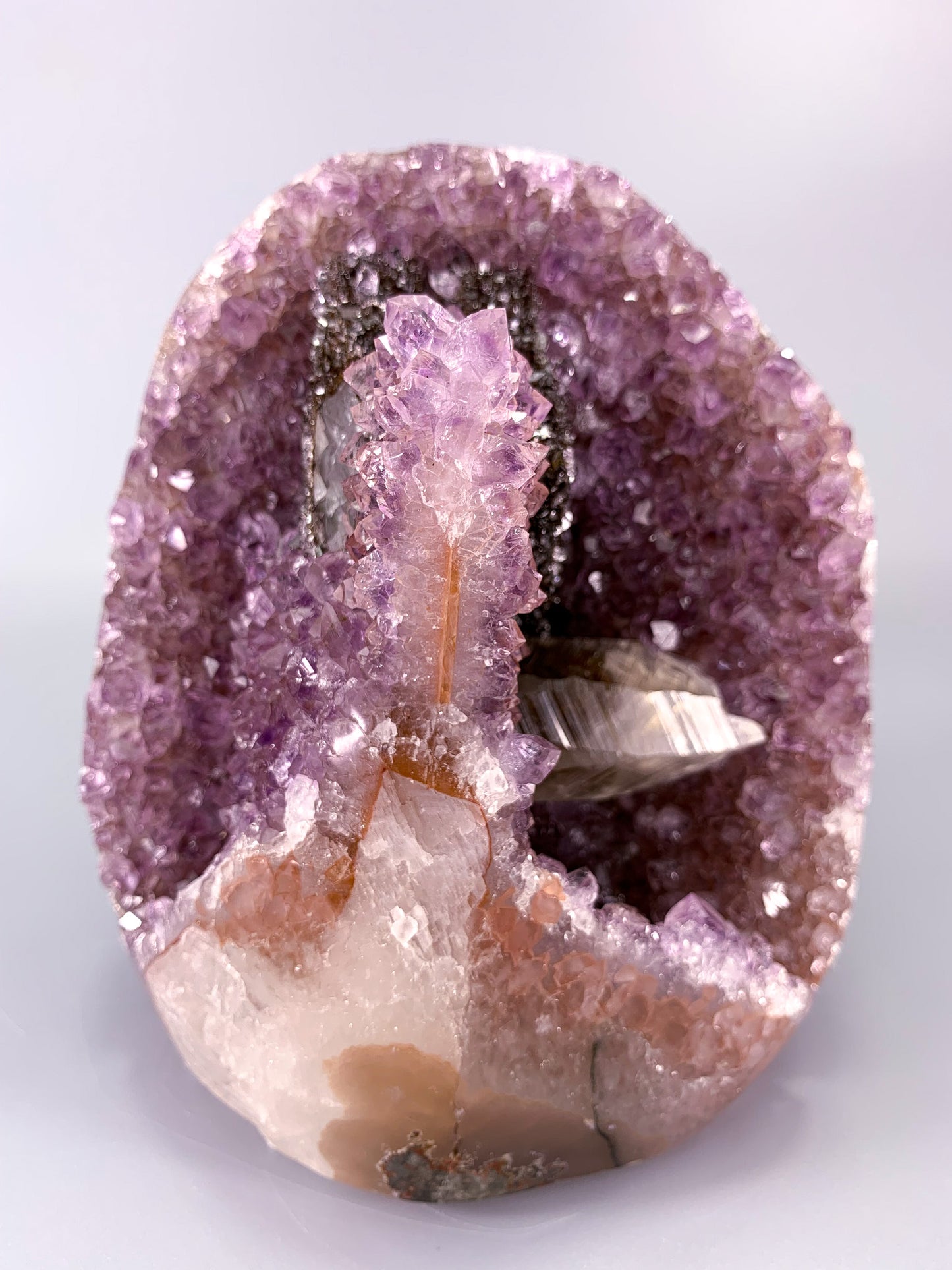 Amethyst natural cluster cut base with clear calcite and Hematite