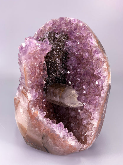 Amethyst natural cluster cut base with clear calcite and Hematite