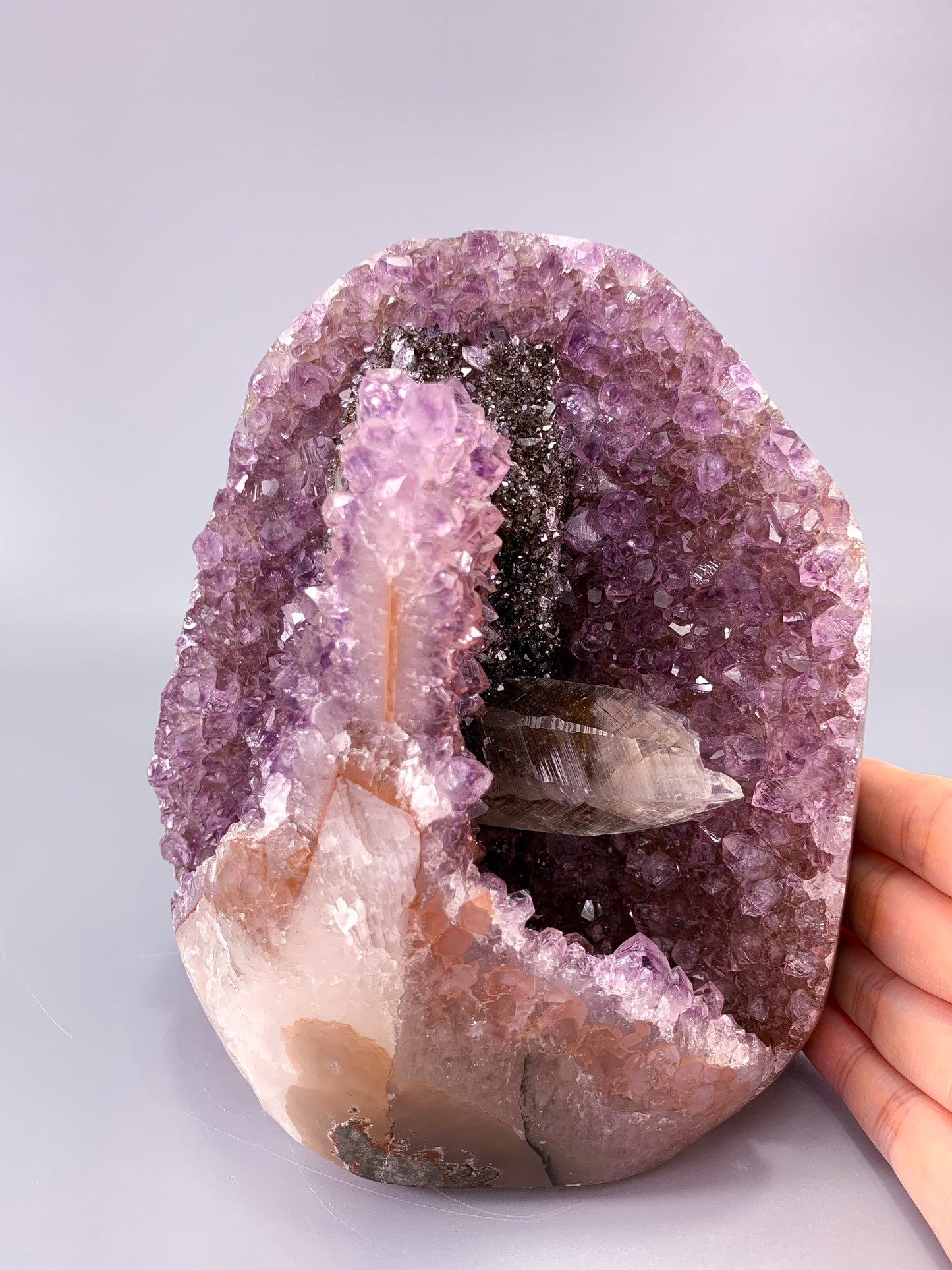 Amethyst natural cluster cut base with clear calcite and Hematite