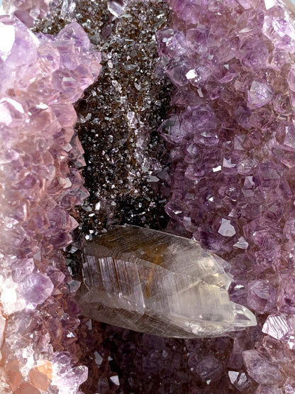 Amethyst natural cluster cut base with clear calcite and Hematite