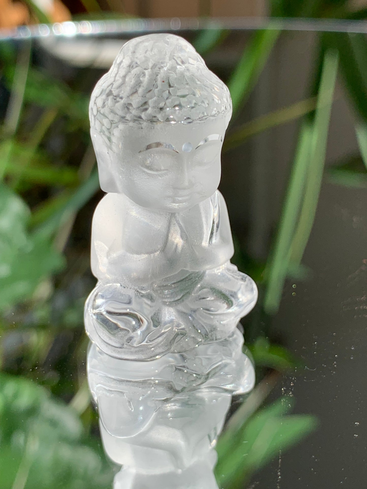 Clear Quartz carved Buddha figure